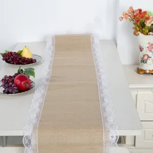 Burlap table runner with white lace trim detail, rustic vintage style for decor and parties.