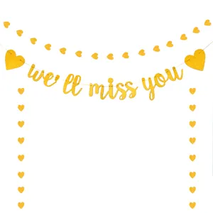 Gouden glitter afscheid banner detail met elegante hart slingers en letter decoraties.