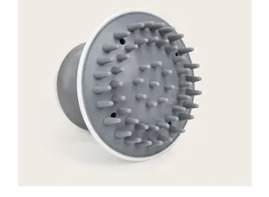 Vue detaillee de brosse de massage du cuir chevelu en silicone avec picots coniques doux.