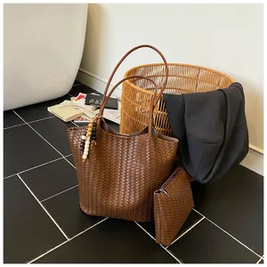 Brown woven leather tote bag for women, retro shoulder bag with pouch for daily commuting.