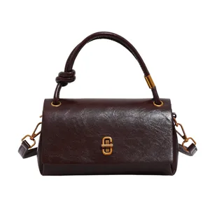 Stylish dark brown women's handbag with top knot handle and metal lock. Perfect for daily commuting.