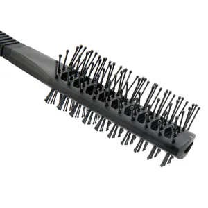 Professional black hair styling brush for men blow drying and daily hair care use.
