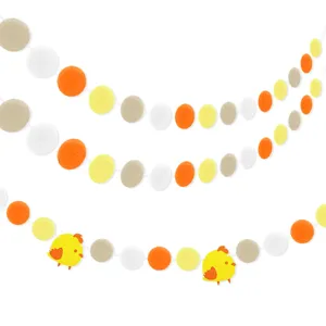 Easter felt ball garland detail view, vibrant pom pom and cute chick party decoration.