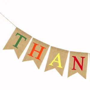 Burlap banner detail showing the thankful letter print on rustic jute swallowtail flags.