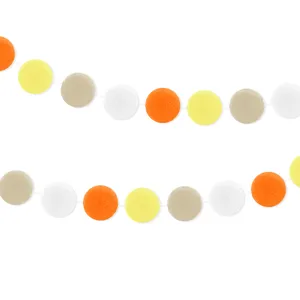 Colorful pom pom garland for party decoration, handmade felt ball banner for Easter celebration.