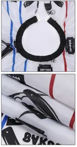 Professional barber cape detail showing elastic neckline, hooks, and stylish print design.