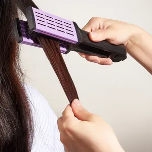 V-shaped hair straightening brush styling tool with purple and black design for home use.
