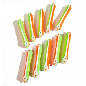 Green and orange hair perm rods set, professional salon curling rollers for hair styling tools.