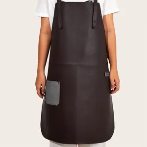 Close up of retro leather work apron with grey pocket, durable utility apron for daily work.