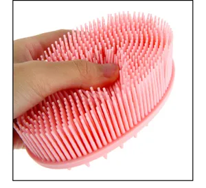 Pink silicone shampoo brush for scalp massage, soft hair scrubber for wet and dry daily use.
