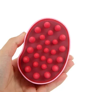 Cepillo de masaje para el cuero cabelludo de silicona para champú, diseño ergonómico rosa.