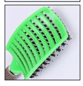 Curved hair brush with boar bristles and textured handle for styling massage detangling daily use.