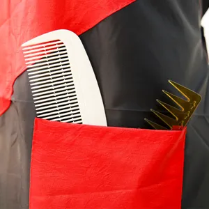 Professional hair salon cutting cape with red pocket and combs, waterproof barber gown for adults.
