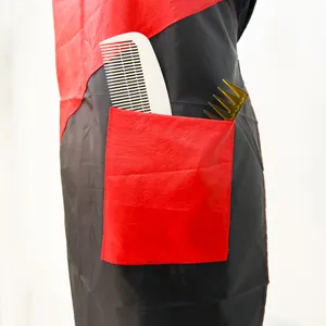 Professional hairdressing apron with pockets and contrast color design for salons.