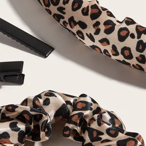 Leopard print heatless curling rod headband and scrunchies set for effortless waves and styling.