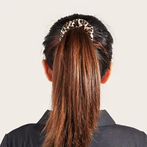 Stylish leopard print hair scrunchie elastic hair tie for women ponytail fashion styling.