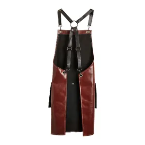 Retro leather barber apron with adjustable straps and metal buckles for hairstyling work.