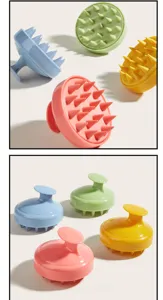Détail de la brosse de massage du cuir chevelu en silicone avec picots souples et poignée.