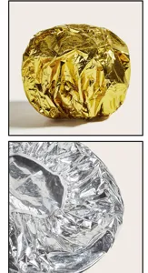 Détails en gros plan des bonnets de soin capillaire en aluminium métallique doré et argenté.