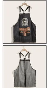 Adjustable denim barber apron with leather tool pockets for professional hair stylists.