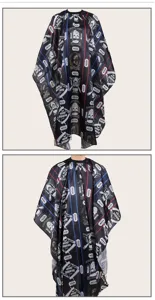 Professional black barber cape with skull and razor print for hair cutting and styling salon.