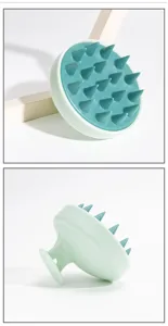 Silicone scalp massage brush detail view showing soft bristles and ergonomic grip handle design.
