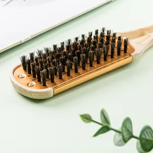 Professional V-shaped hair straightening brush with boar bristles and wooden handle design main view.