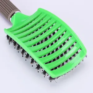 Curved vent hair brush with boar bristles and textured handle for styling and detangling hair.