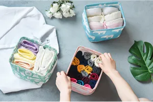 Detail view of foldable fabric storage basket for desk clutter and underwear organization.