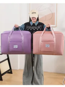 Sac de voyage pliable de grande capacité avec poignées solides et poche zippée avant.