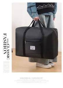 Grand sac de voyage noir pliable avec bandoulière pour les bagages et le rangement facile.
