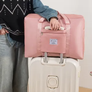 Grand sac de voyage pliable de grande capacite avec sangle pour fixation sur valise