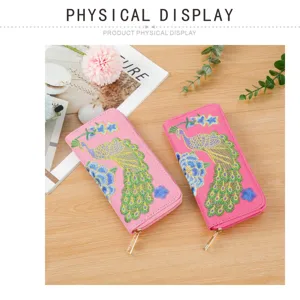 Ethnic style embroidered peacock women long wallet zipper card holder handbag detail shot.