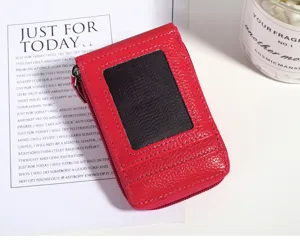 Red leather mini accordion card holder with ID window and multiple slots for women.