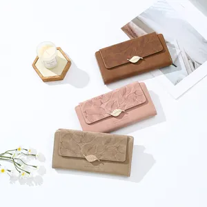Chic long women wallet clutch with retro frosted texture, leaf print and metal clasp.