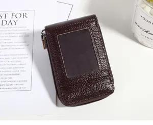 Vertical dark brown leather card holder detail, zipper pocket and clear ID window.