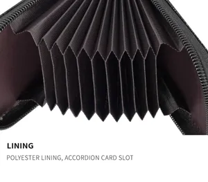 Close-up interior detail of black card holder featuring brown polyester lining accordion slots.