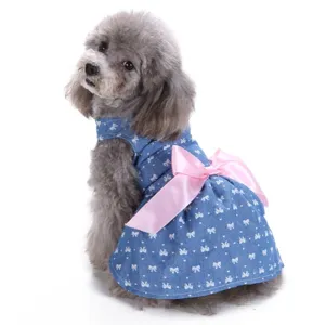 Cute blue denim dog dress with pink bow and white polka dots for stylish summer pet wear
