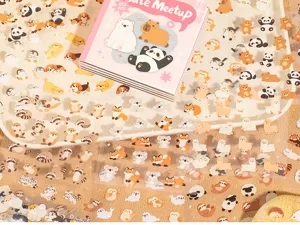 Cute fluffy animal sticker book detail showing pandas, capybaras, dogs and koalas.
