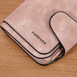 Pink matte leather women short wallet with snap closure and zipper coin pocket close up view