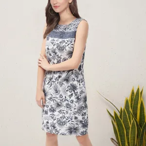 Blue and white floral print sleeveless dress featuring elegant crochet yoke and stylish cut.