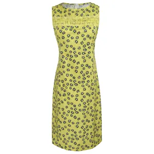 Close-up of yellow floral sleeveless dress with daisy print and crochet lace bodice insert.