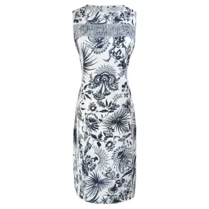 Detail view of the summer sleeveless blue and white floral print midi dress with lace.