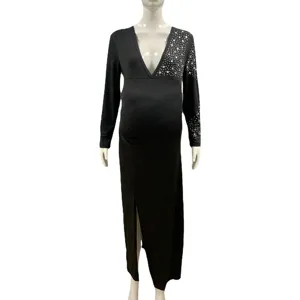 Detailed close-up view of the black maternity long sleeve v-neck dress with sparkling rhinestones.