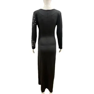 Back view detail of black long sleeve V-neck maternity dress with stunning rhinestone sleeve.