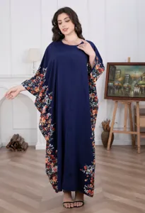Plus size blue floral loose maxi dress detail showing elegant batwing sleeves and hem print.