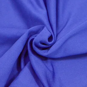 Close up view of solid blue ribbed fabric texture detail for summer casual dress garment.