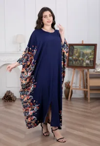 Detailed view of a loose-fitting floral caftan maxi dress in deep blue with colorful sleeves.