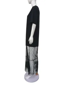 Side view detail of black short sleeve dress with sheer lace splice long hemline.