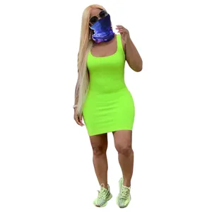 Detail view of neon green ribbed bodycon mini dress, featuring scoop neck and sleeveless fit.